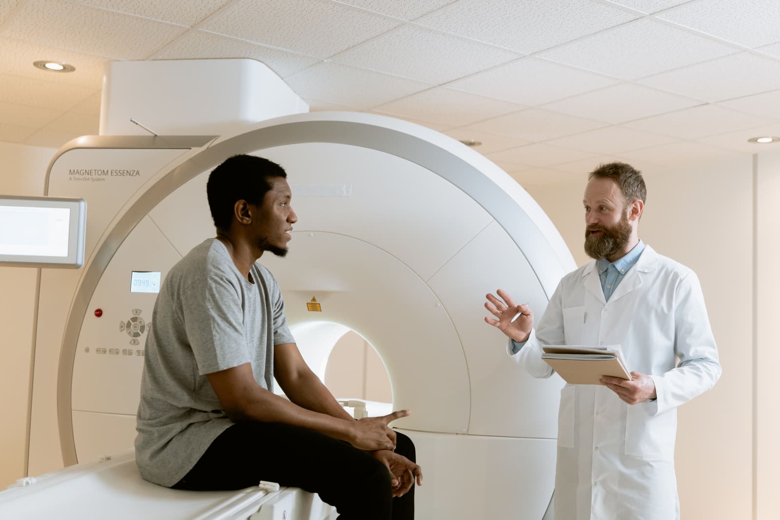 A clinician explaining a scan to the person being seen at Wharfside.