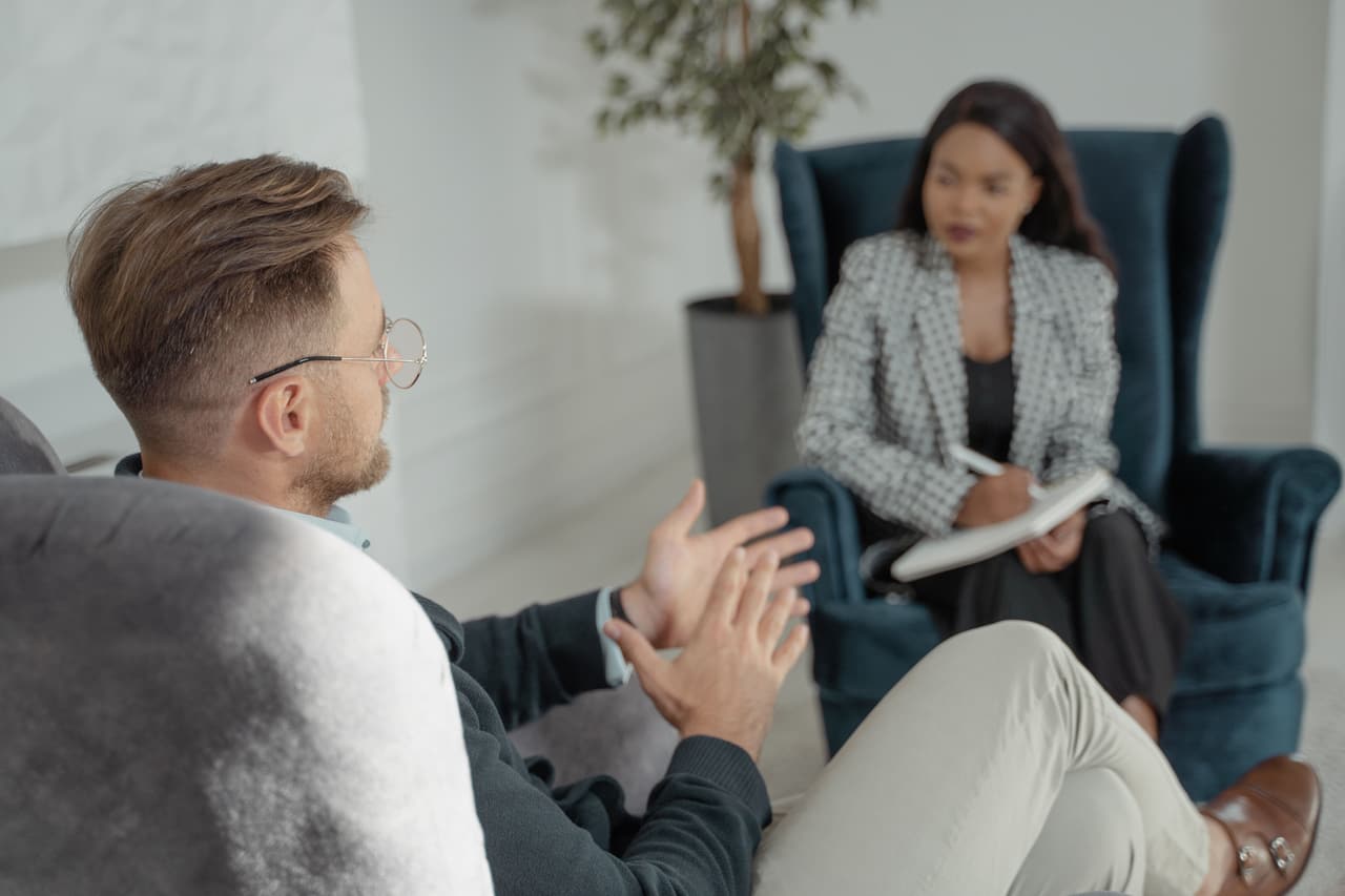 A seated conversation in one of the quiet consulting rooms.