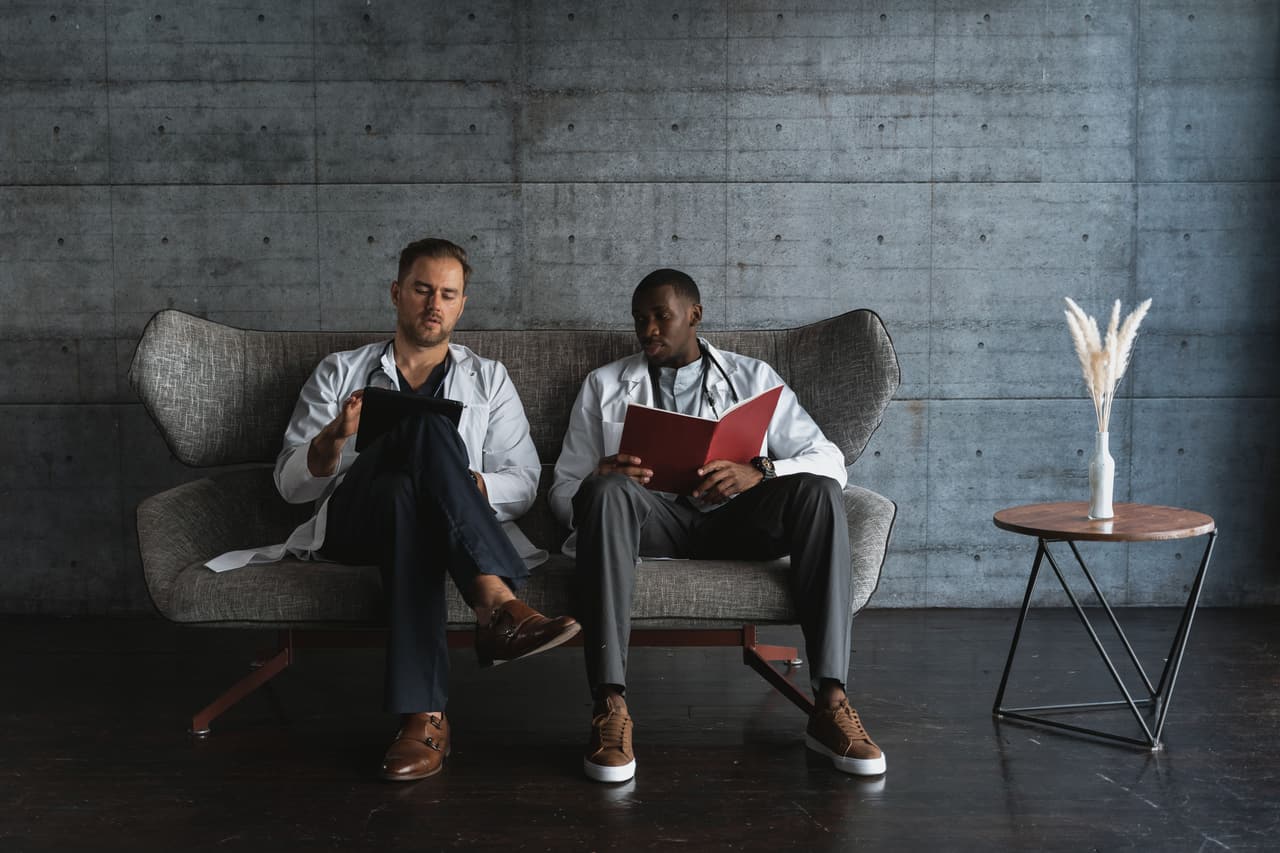 Two consultants talking a case through together.